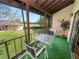 Private screened balcony with a view of the pool and green space at 230 La Casa # 230, Lake Wales, FL 33898