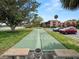 Two shuffleboard courts nestled in a grassy area with trees at 230 La Casa # 230, Lake Wales, FL 33898