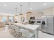 Modern kitchen with island, stainless steel appliances, and pendant lighting at 2347 Southbury Dr, Kissimmee, FL 34744