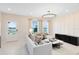 Spacious living room with large windows and modern furniture at 2347 Southbury Dr, Kissimmee, FL 34744