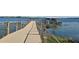 Community dock with two covered structures and a floating dock at 2362 Datura Loop, St Cloud, FL 34772