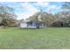 Wide shot of the expansive property with multiple outbuildings at 2432 4Th St, Orlando, FL 32820