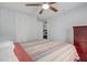 Bedroom featuring a ceiling fan, closet, and dark wood dresser at 2432 4Th St, Orlando, FL 32820