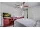This bedroom features a wooden dresser and a ceiling fan at 2432 4Th St, Orlando, FL 32820