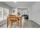 Dining area with wood table set is flooded with natural light at 2432 4Th St, Orlando, FL 32820