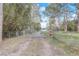 Gated driveway with a charming entrance and a private road leading to the residence at 2432 4Th St, Orlando, FL 32820