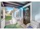 Inviting front porch with comfortable seating and a charming welcome mat, leading to the front door at 2432 4Th St, Orlando, FL 32820