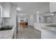 Bright kitchen features stainless steel appliances, granite countertops, and open floor plan at 2432 4Th St, Orlando, FL 32820