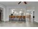 Open-concept kitchen with a breakfast bar, stainless steel appliances, and a view to the dining area at 2432 4Th St, Orlando, FL 32820