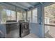 Modern laundry room featuring stainless steel washer and dryer with views to the backyard at 2432 4Th St, Orlando, FL 32820