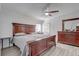 Spacious main bedroom featuring a large bed, matching furniture, and a ceiling fan at 2432 4Th St, Orlando, FL 32820