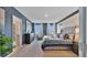 Large bedroom with a king-size bed and an ensuite bathroom at 33459 Copper Hill Way, Sorrento, FL 32776