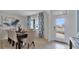 Elegant dining room featuring a large table, plush chairs, and stylish curtains at 33459 Copper Hill Way, Sorrento, FL 32776