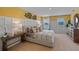 Spacious bedroom with large bed, neutral color palette and natural light at 4257 Singing Mockingbird Blvd, Bartow, FL 33830