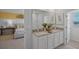 Double vanity bathroom with granite countertops and modern fixtures at 4261 Singing Mockingbird Blvd, Bartow, FL 33830