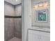 Modern bathroom with a large shower and granite countertop at 43 Water Track Dr, Ocala, FL 34472
