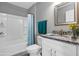 Bathroom featuring tub, shower, granite countertops, and modern fixtures at 43 Water Track Dr, Ocala, FL 34472