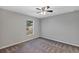 Spacious bedroom with ceiling fan and carpeting at 43 Water Track Dr, Ocala, FL 34472