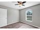 Bedroom with neutral paint, a ceiling fan, and a bright window at 43 Water Track Dr, Ocala, FL 34472