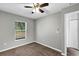 Well-lit bedroom with carpet flooring, ceiling fan and window at 43 Water Track Dr, Ocala, FL 34472