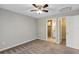 Bedroom with ceiling fan, carpet, and ensuite bathroom at 43 Water Track Dr, Ocala, FL 34472