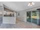 Spacious dining room with tile floors and sliding glass doors at 43 Water Track Dr, Ocala, FL 34472