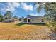 View of the house exterior and large backyard at 43 Water Track Dr, Ocala, FL 34472