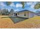 House exterior showcasing backyard and screened porch at 43 Water Track Dr, Ocala, FL 34472