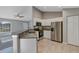 Modern kitchen with stainless steel appliances and granite countertops at 43 Water Track Dr, Ocala, FL 34472