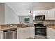 Modern kitchen with stainless steel appliances and granite countertops at 43 Water Track Dr, Ocala, FL 34472