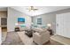 Staged living room with ample natural light, comfortable seating, and neutral tones for a relaxing atmosphere at 43 Water Track Dr, Ocala, FL 34472