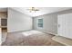 Living room with grey walls, carpeted floor, and ceiling fan at 43 Water Track Dr, Ocala, FL 34472