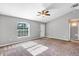 Living room with grey walls, carpeted floor, and ceiling fan at 43 Water Track Dr, Ocala, FL 34472
