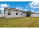 Well-maintained backyard with green lawn and fence offering privacy and outdoor living space at 4455 Indigo Sky Ln, Kissimmee, FL 34744