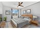 Relaxing bedroom featuring a ceiling fan, natural light, and calming decor to promote a peaceful night's sleep at 4455 Indigo Sky Ln, Kissimmee, FL 34744