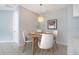 Cozy dining area with modern pendant lighting and seating for four, perfect for everyday meals at 4455 Indigo Sky Ln, Kissimmee, FL 34744