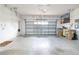 Spacious two-car garage with an automatic door opener and plenty of room for storage at 4455 Indigo Sky Ln, Kissimmee, FL 34744