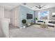 Upstairs living area featuring contemporary furnishings and a bright accent wall. The room has great light at 4455 Indigo Sky Ln, Kissimmee, FL 34744