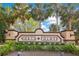 Community entrance sign for North Pointe surrounded by lush landscaping and mature palm trees at 4455 Indigo Sky Ln, Kissimmee, FL 34744