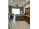 Kitchen features wood cabinets, wine cooler, and sliding glass doors at 5427 Los Palma Vista Dr, Orlando, FL 32837