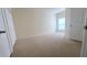 Bright bedroom with carpeted floors and neutral walls at 5979 Westgate Dr # 1021, Orlando, FL 32835