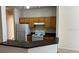 Efficient kitchen features ample cabinetry and a breakfast bar at 5979 Westgate Dr # 1021, Orlando, FL 32835