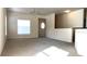 Bright and spacious living room with large windows and neutral carpeting at 5979 Westgate Dr # 1021, Orlando, FL 32835