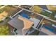 Aerial view of the home and backyard featuring a pool, patio, shed, and fenced yard at 657 Hunters Run Blvd, Lakeland, FL 33809