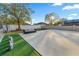 An outdoor seating area with a couch is on the patio in the backyard with grass and statues at 657 Hunters Run Blvd, Lakeland, FL 33809