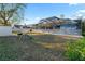 The backyard features a lawn, screened-in pool, play set, fenced yard, and shed at 657 Hunters Run Blvd, Lakeland, FL 33809