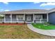 Inviting front yard, complete with a sidewalk leading to the front door and lush landscaping at 657 Hunters Run Blvd, Lakeland, FL 33809