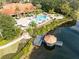 Community pool, clubhouse, and lake view at 8519 Bay Lilly Loop, Kissimmee, FL 34747