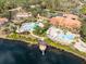 Community pool and clubhouse with lake and homes at 8519 Bay Lilly Loop, Kissimmee, FL 34747