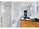 Bathroom with granite vanity and shower stall at 8519 Bay Lilly Loop, Kissimmee, FL 34747